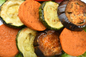 Grilled vegetables, sweet potato, zucchini, eggplant, laid in neat layers, rows. Bright, juicy, macro.