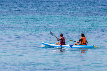 Tourists canoeing on the beautiful sea around Lipe Island, Satun, Thailand