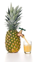 Pineapple juice pouring into glass