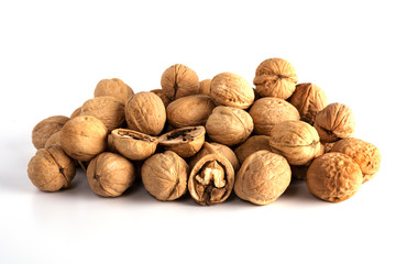 a large number of walnuts on a white background