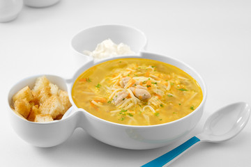 close up view of nice yummy russian noodle soup on white back