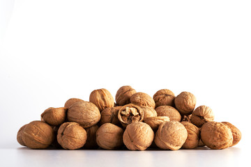 a large number of walnuts on a white background
