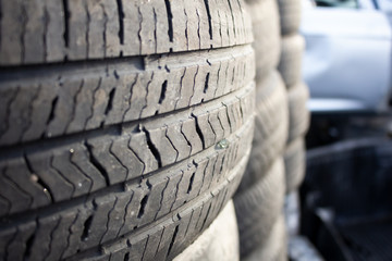 A closeup of several stacks of tires and tread patterns.