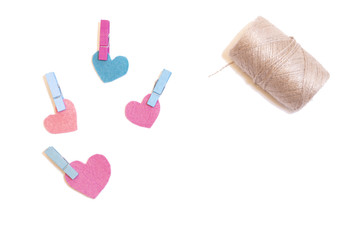 Felt heart, colorful clothespins. Copy space. Place for text and design. Copy space. Place for text and design. White background.