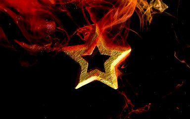 Golden star on a fantastic fiery background. Defender of the Fatherland Day February 23