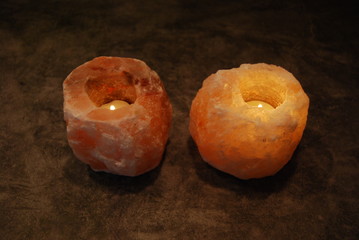 Himalyan Salt Lamp Candles Lit on natural background