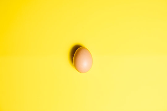 Fresh Easter Egg on a Yellow Background. Happy Easter