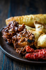 Rava Bhajj or bhajiya also known as suji Pakoda or semolina Pakora with Indian Asian Food Samosas / Samsa, Aloo Tikki and Spring Rolls.
