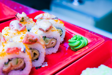 sushi rolls cooked on a plate in a restaurant