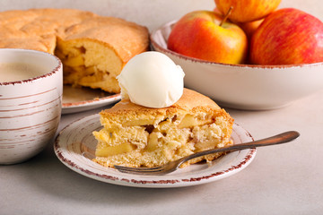 Apple cake with scoop of ice cream, served