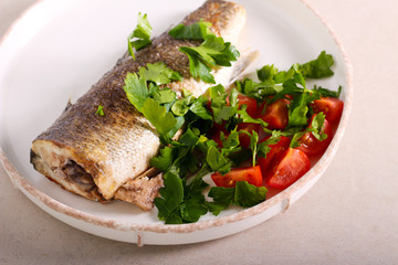 Steamed Seabass fish with salad served