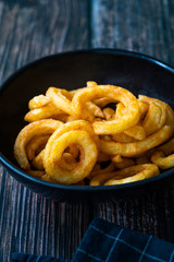 Spicy Seasoned Curly Fries Ready to Eat with Sauce.