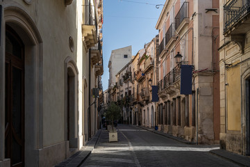Fototapeta na wymiar Picturesque street in Ortigia, Siracusa old town, Sicily, southern Italy