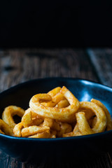 Spicy Seasoned Curly Fries Ready to Eat with Sauce.