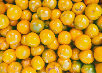 Healthy fruits, orange fruits background, many oranges with leaf freshly picked during the harvest in the thailand