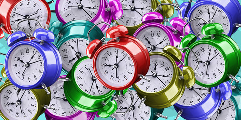 Background of alarm clocks of different colors.