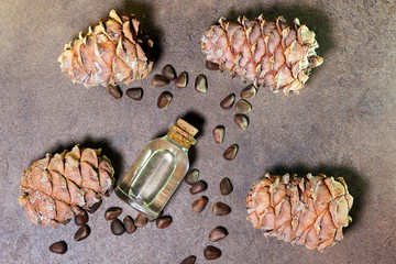 Pine nut oil on a brown background treatment of skin diseases. This is an excellent tool for...