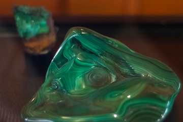 Green malachite. An ancient, fragile ornamental stone that brings fulfillment of desires to its owner. Mineral