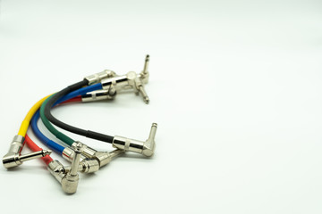 Male to male 6.35 mm jack cable white background, music concept