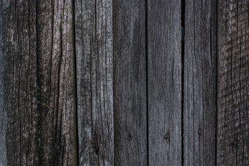 texture of gray rotten wooden boards with rusty nails and cracks