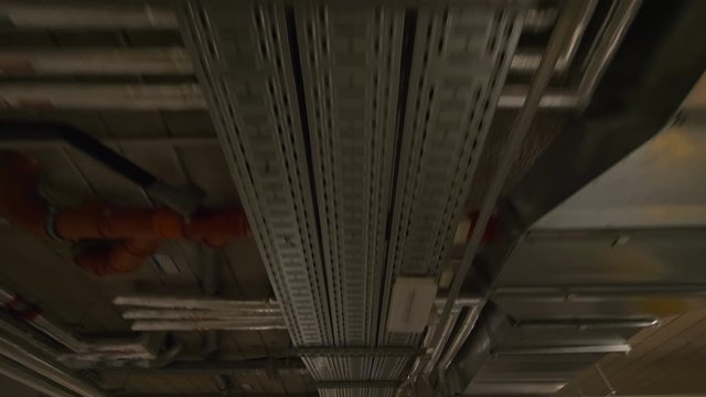 Pipeline on the ceiling in factory in 4k slow motion 60fps