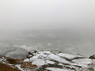 Majestic landscape of Gullfoss (golden waterfall) in Iceland on a cold November day: Outdoor scenery with water flowing down rocks and cliffs in a beautiful wild park in arctic North Europe