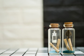 A small tree in a small glass bottle