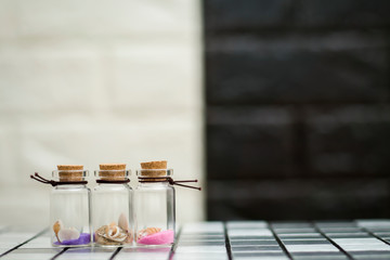 Shells in three small glass bottles