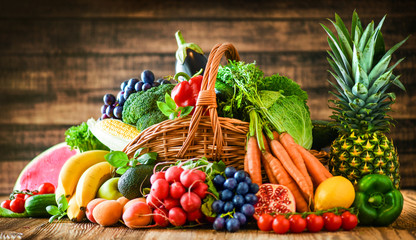Composition with assorted raw organic fresh vegetables. Assortment of fruits and vegetable. Healthy raw detox food diet concept.
