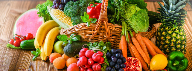 Composition with assorted raw organic fresh vegetables wide banner. Assortment of fruits and vegetable. Healthy raw detox food diet panorama concept.