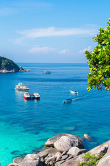 Holidays on the Similan Islands. Exotic vibrant nature, turquoise water and the bright sun in Thailand.