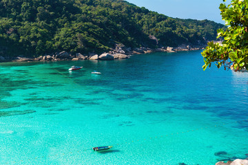 Holidays on the Similan Islands. Exotic vibrant nature, turquoise water and the bright sun in Thailand.