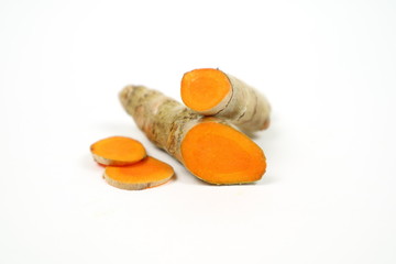 Fresh turmeric isolated on a white background is used as a tonic for the body and food ingredients.