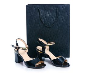 Black high heels sandals and shopping bag fashion beauty on white background isolation
