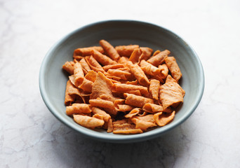 Traditional spicy chinese yam potato chips in a bowl
