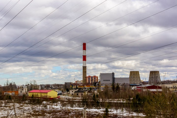 Obraz premium Industrial landscape of pipes of thermal power station and high-voltage wires