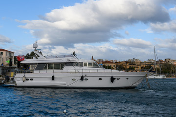 Fototapeta na wymiar Motor yacht moored in the marina
