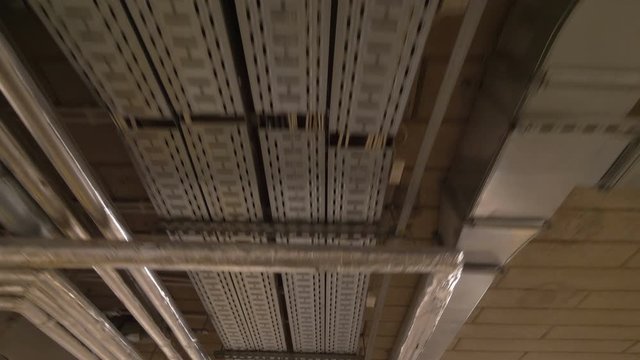Pipeline on the ceiling in factory in 4k slow motion 60fps