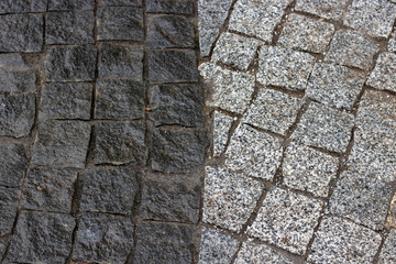 Rough texture of wet block pavement, Saint Malo old side-street