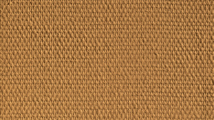 Yellow painted fiberglass wallpaper in the light of the sun