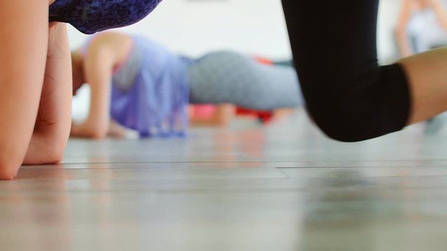 Dance fitness zumba class group of beautiful women dancing enjoying workout practicing choreography moves with instructor in fitness studio, 4k slow motion