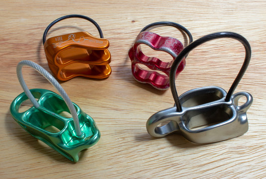 Four belay devices, two of them with guide mode function