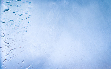 Blue water drops background.Frozen ice 