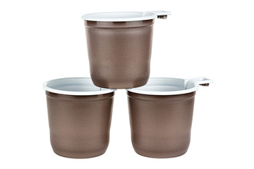 Pyramid of three unused disposable white plastic mugs with brown satin texture on the outside isolated on white background