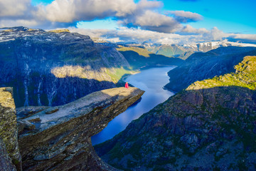 The tourist on the Trolltunga, Norway.