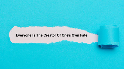 Blank blue pieces of torn paper. Everyone is the creator of one's own fate.