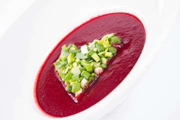 Beetroot cream soup with a heart made of chives - a romantic treat	
