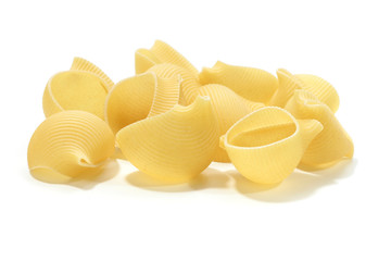 A lot of italian's raw pasta(macaroni) conchiglie on a white background