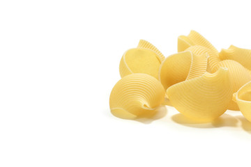 A lot of italian's raw pasta(macaroni) conchiglie on a white background