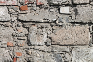 Different bricks in the wall background texture red gray